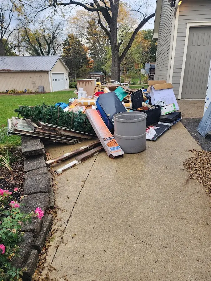 Dumpster being loaded with debris for 3 Yard Dumpster Rental in South Weber